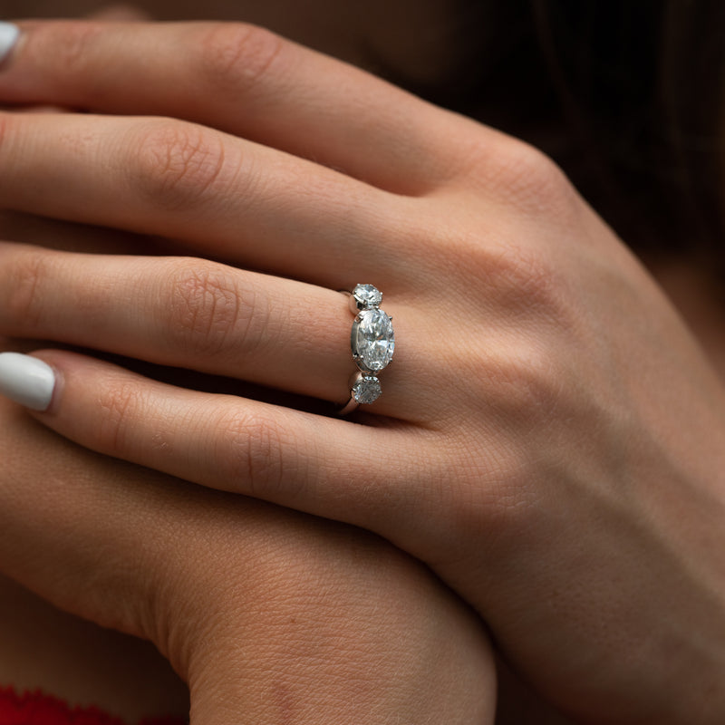 Close up of The Jessica oval centre and Georgian style side stones engagement ring