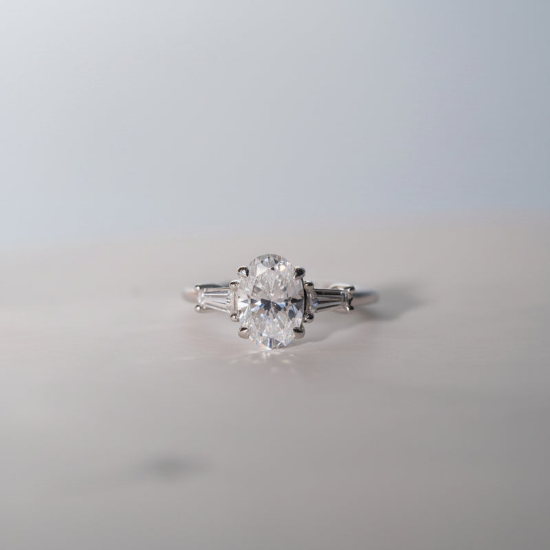 Trilogy Engagement Ring by Ethica Diamonds, oval cut lab diamond with tapered baguette side stones