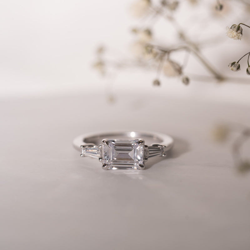 Cora Ring by Ethica Diamonds, east west emerald cut lab diamond with tapered baguette side stones