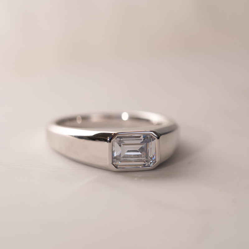 The Dillon by Ethica Diamonds is an emerald cut lab created diamond modern bezel set diamond ring