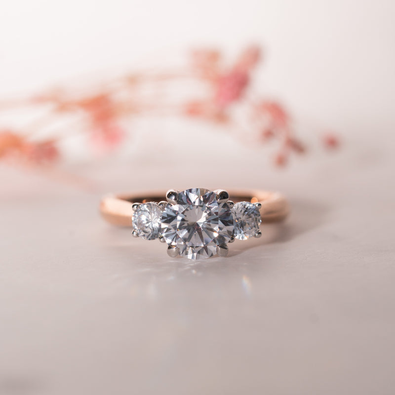 The Jasmine Ring – round brilliant lab diamond trilogy engagement ring with scroll detail