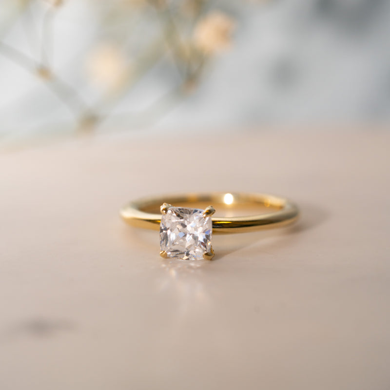 Close-up of Leola Ring showing cushion cut centre stone and delicate pavé diamonds