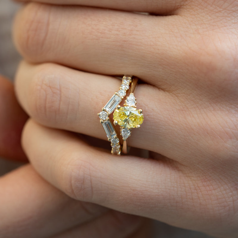 Close up of yellow oval lab diamond and pear side stones at 1.13ct total.