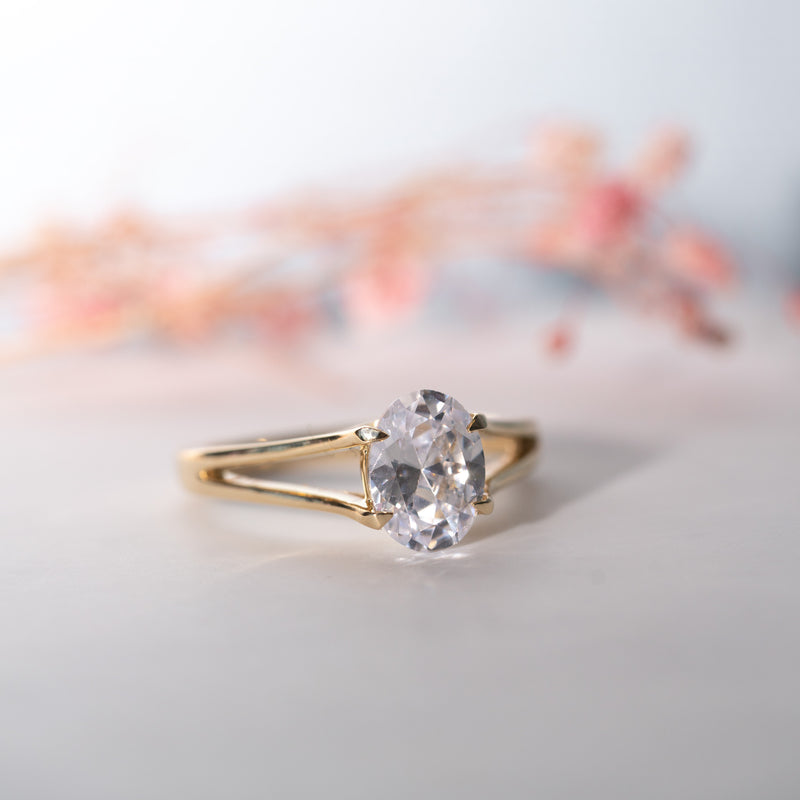 The Maris Ring featuring a brilliant oval lab diamond set in a recycled gold split shank setting.