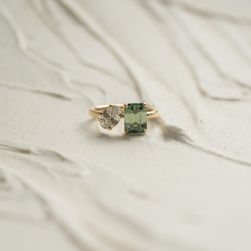 The oriana by ethica diamond toi et moi emerald diamond green and oval cut engagement ring