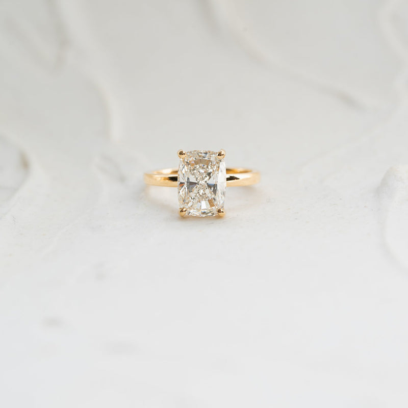 yellow gold solitaire elongated cushion hidden halo diamond engagement ring by ethica diamonds in cornwall