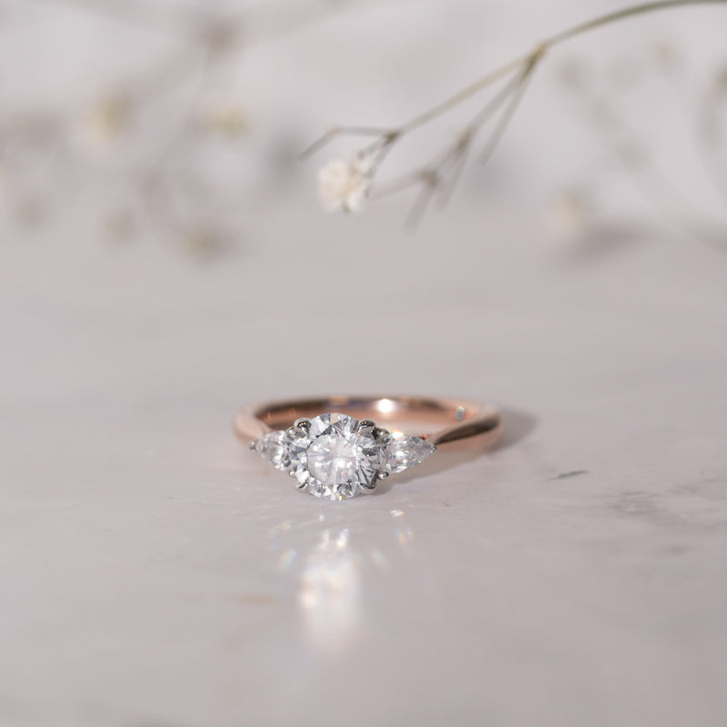 flatlay Sophia trilogy lab diamond engagement ring by Ethica Diamonds.