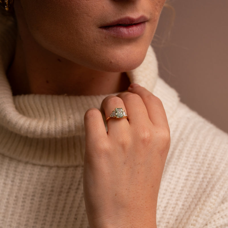 Amber accented ring green fancy lab on models hand by Ethica Diamonds