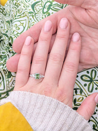 Bespoke green gemstone platinum engagement ring close up - custom commission by Laura at Ethica Diamonds Cornwall