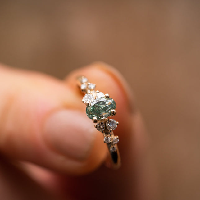 close view of green lab grown ethical engagement ring by Ethica Diamonds