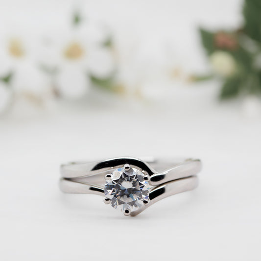 Round brilliant cut lab created diamond secured into contoured band  made from recycled ethically sourced gold or platinum 