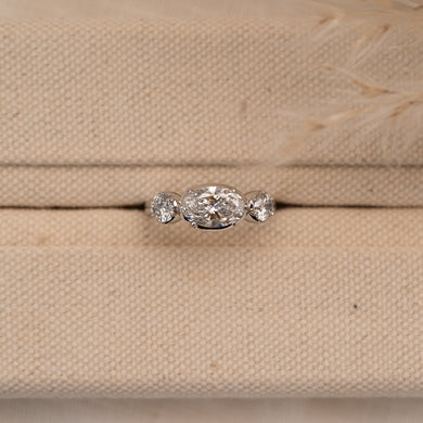 Trilogy unique modern engagement rings photographed in material ring box 