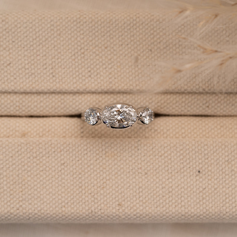 Trilogy unique modern engagement rings photographed in material ring box 