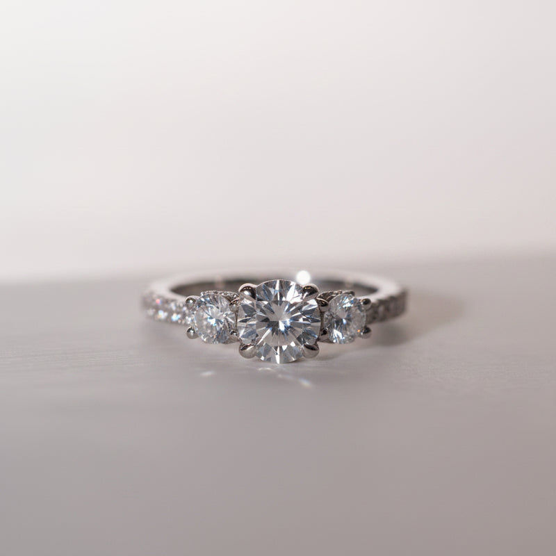 Elegant white gold multistone diamond ring with diamond set band 