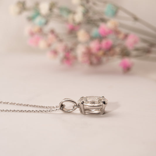 2.0ct classic oval diamond pendant in platinum flat lay on table side view