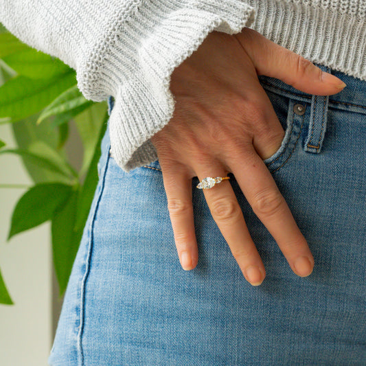 Lab diamond ring made in cornwall in east west diamond setting worn on hand in jeans pocket