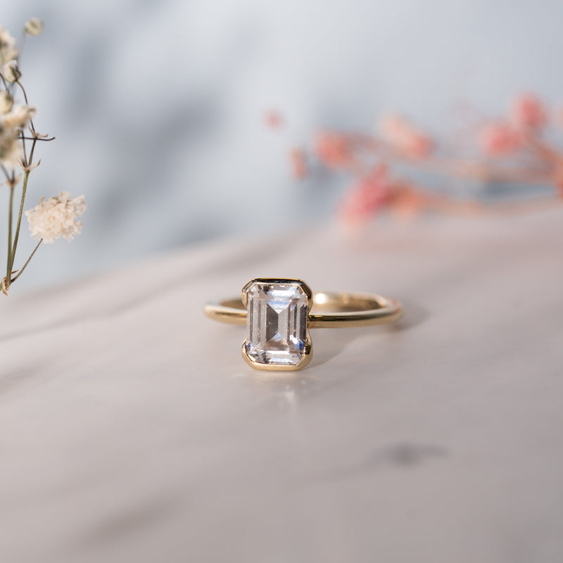 Danae Ring by Ethica Diamonds, emerald cut lab diamond in split rubover setting with slim minimalist band