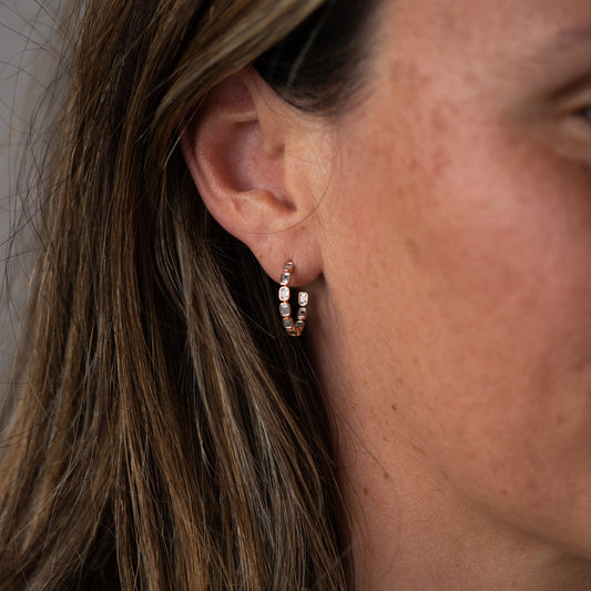 9k yellow gold and lab grown diamond hoop earrings highlighting modern, minimalist design. By Ethica Diamonds