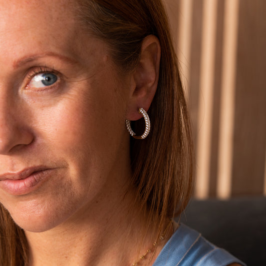 Everyday-to-evening gold earrings with subtle hidden sparkle