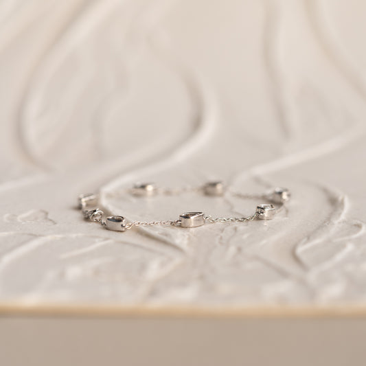 Dainty gold station bracelet with lab grown diamonds in refined bezel mounts by Ethica Diamonds