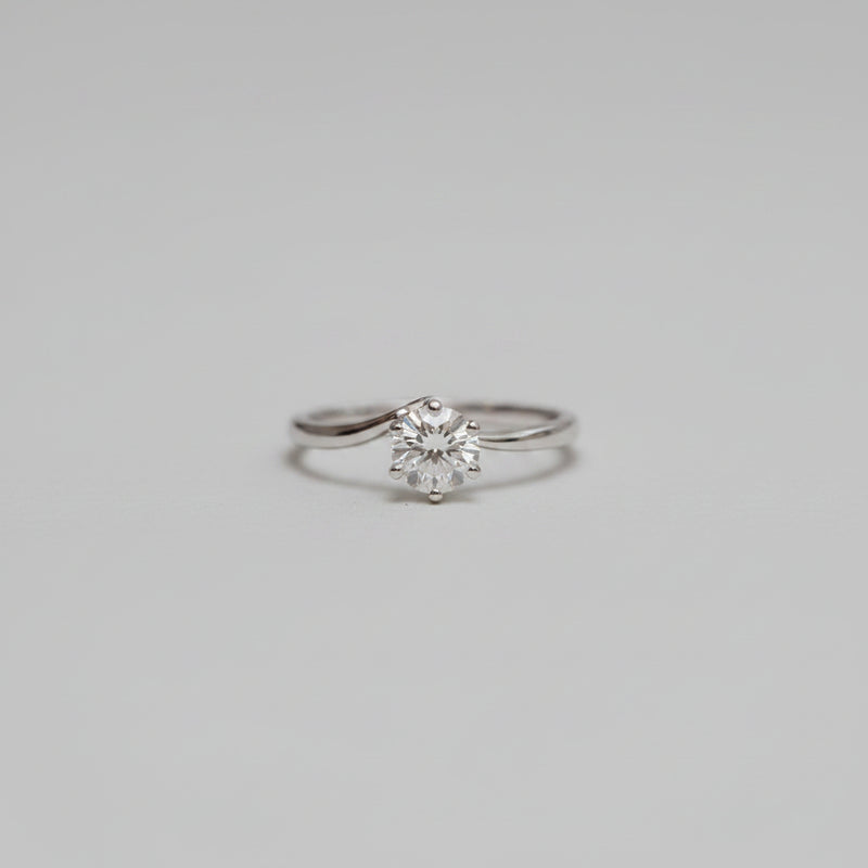 a dainty delicate solitaire diamond ring with a contoured band and a lab created diamond made in cornwall 