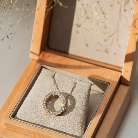 Diamond Circle Necklace in yellow gold in wooden jewellery box