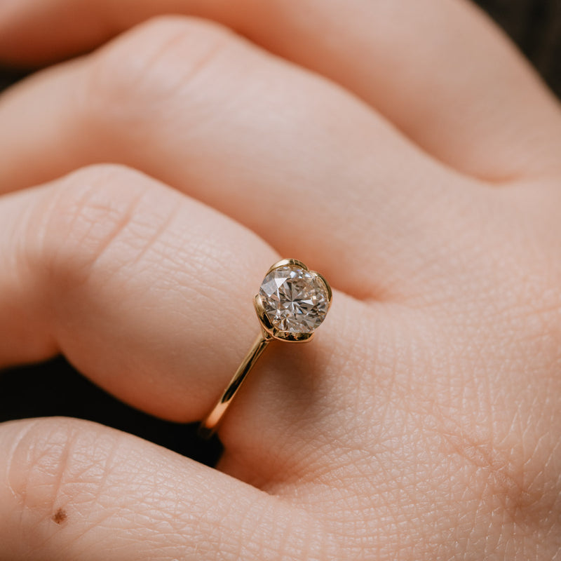 Close up of 1 carat The Callis tulip setting round lab diamond on hand by Ethica Diamonds in cornwall