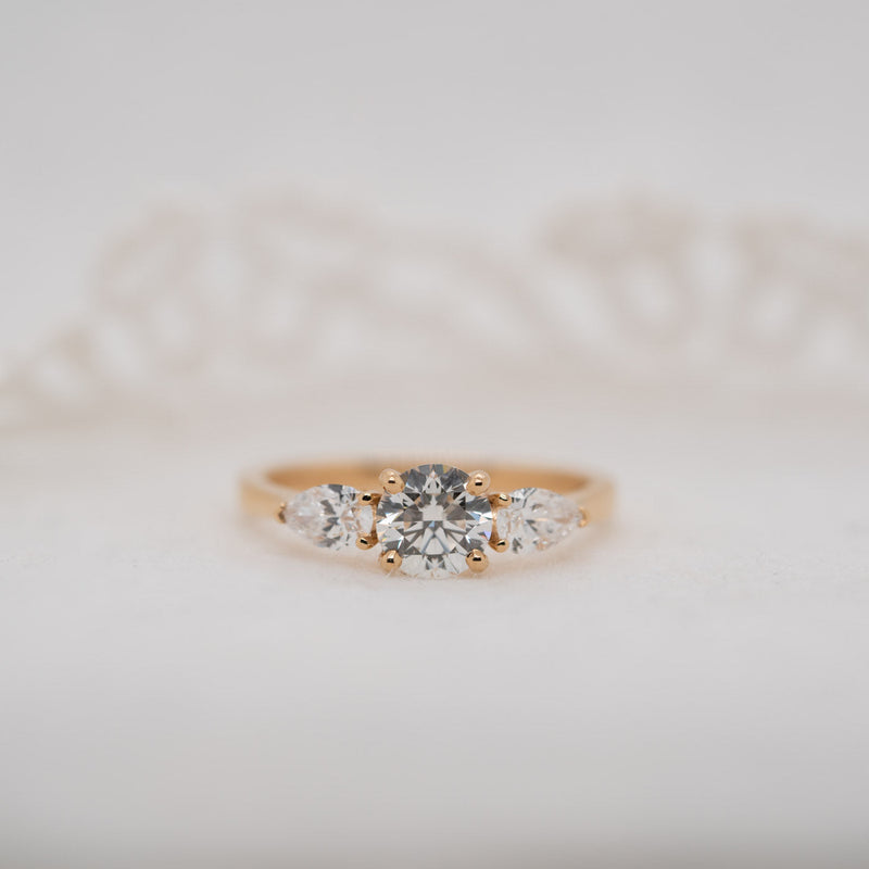 Fine detail of lab grown diamond trilogy set in precious metal – The Georgia