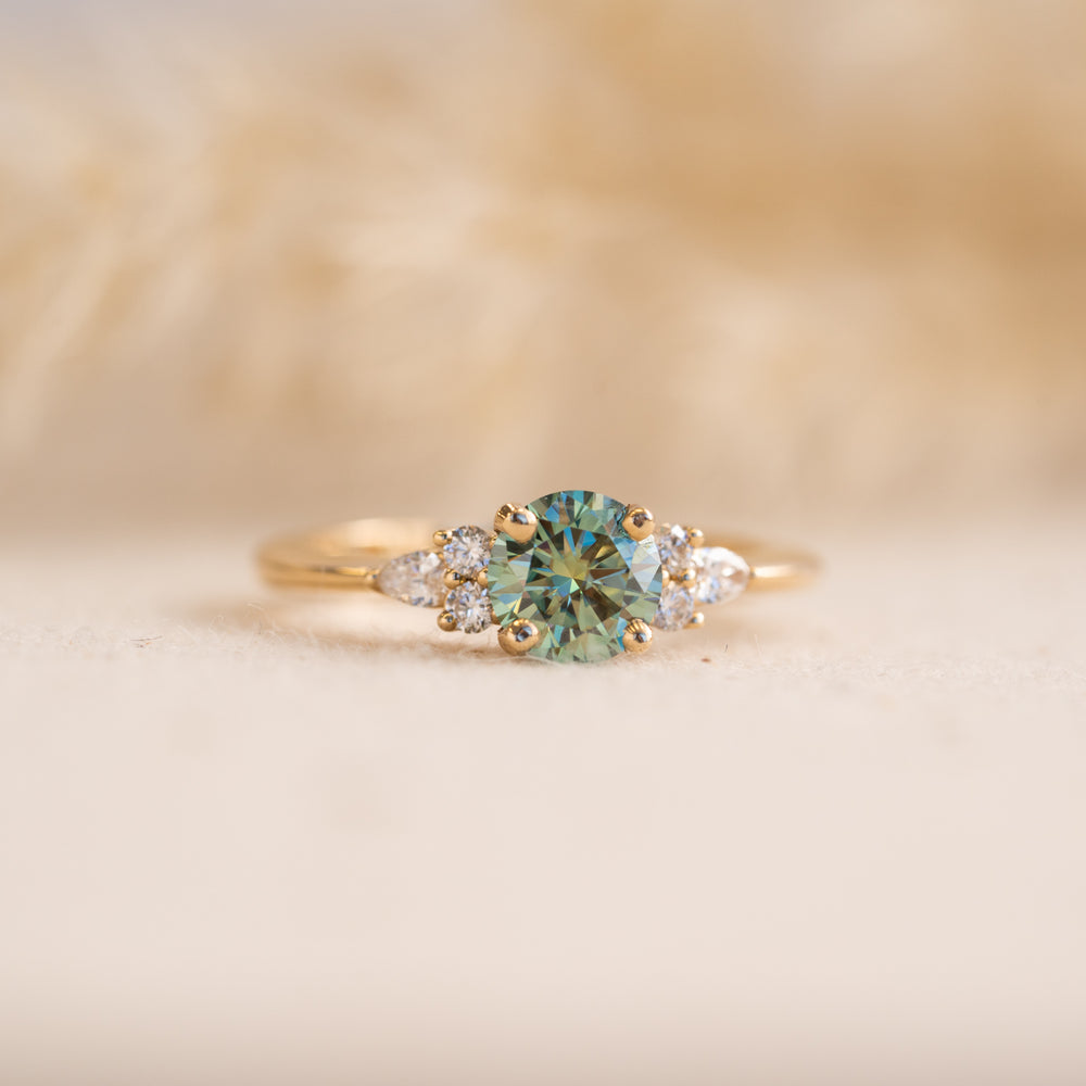 Elegant round brilliant moissanite engagement ring with side stones