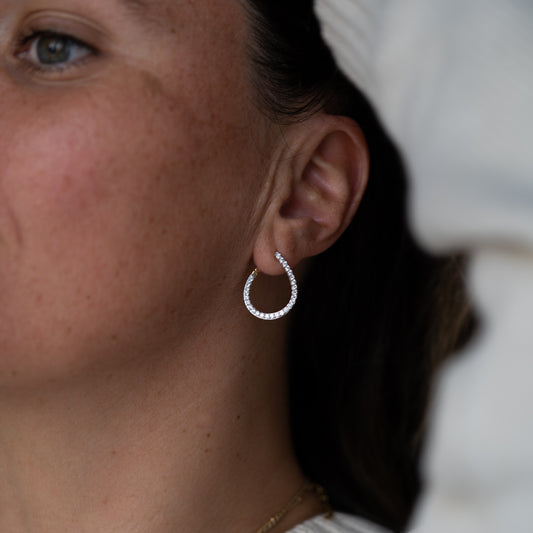 Pavé diamond spiralled hoop earrings front angle