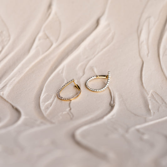 The Mara spiralled hoops in white, yellow, or rose gold