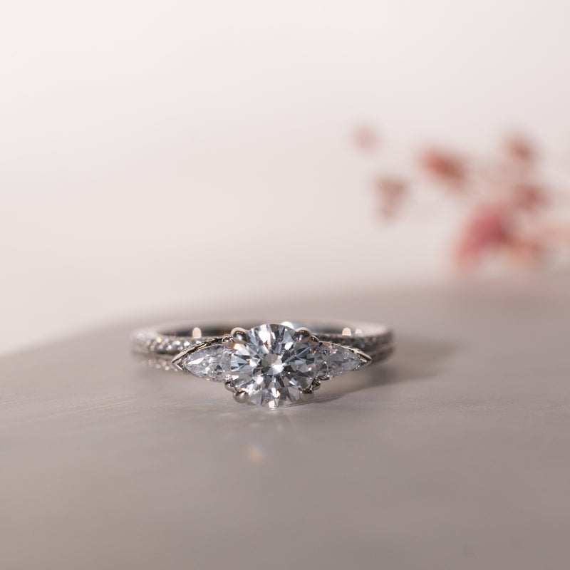Close up of Meredith Ring by Ethica Diamonds flat lay front view ethical lab grown diamonds and twisted shoulder set diamonds