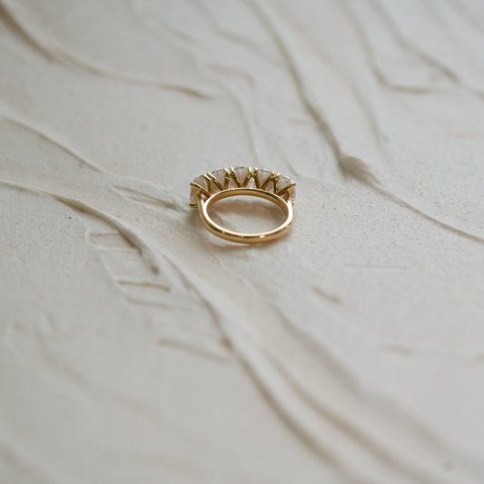 Multistone oval diamond engagement ring with 5 lab diamonds in 18k gold laid flat