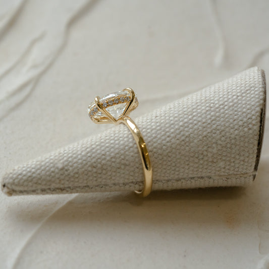 Gold lab diamond engagement ring with hidden halo diamond detail in yellow gold