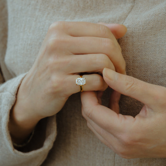 model wears the sira by ethica diamonds recycled gold and lab diamond solitaire  jewellery