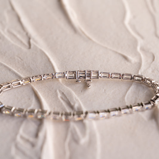 back view of The Soraya semi-bezel emerald diamond tennis bracelet by Ethica Diamonds Cornwall