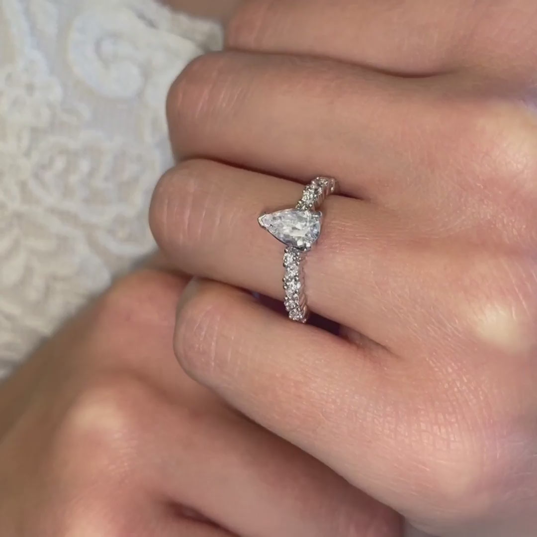 video pear cut engagement ring by Ethica Diamonds shoulder accents