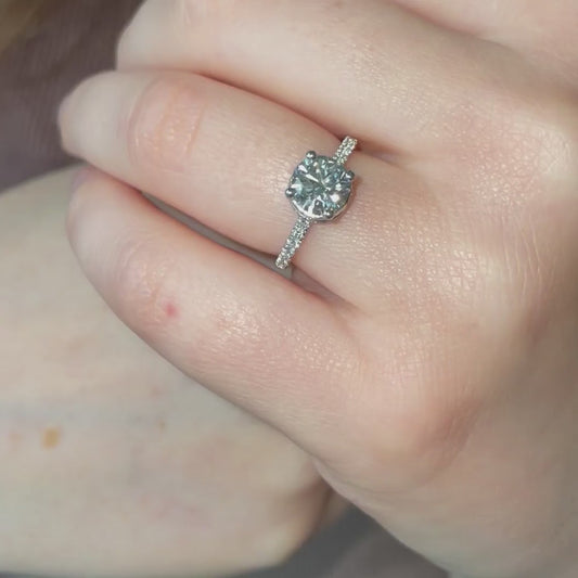 video of model wearing 1.5ct solitaire in platinum and shoulder set band