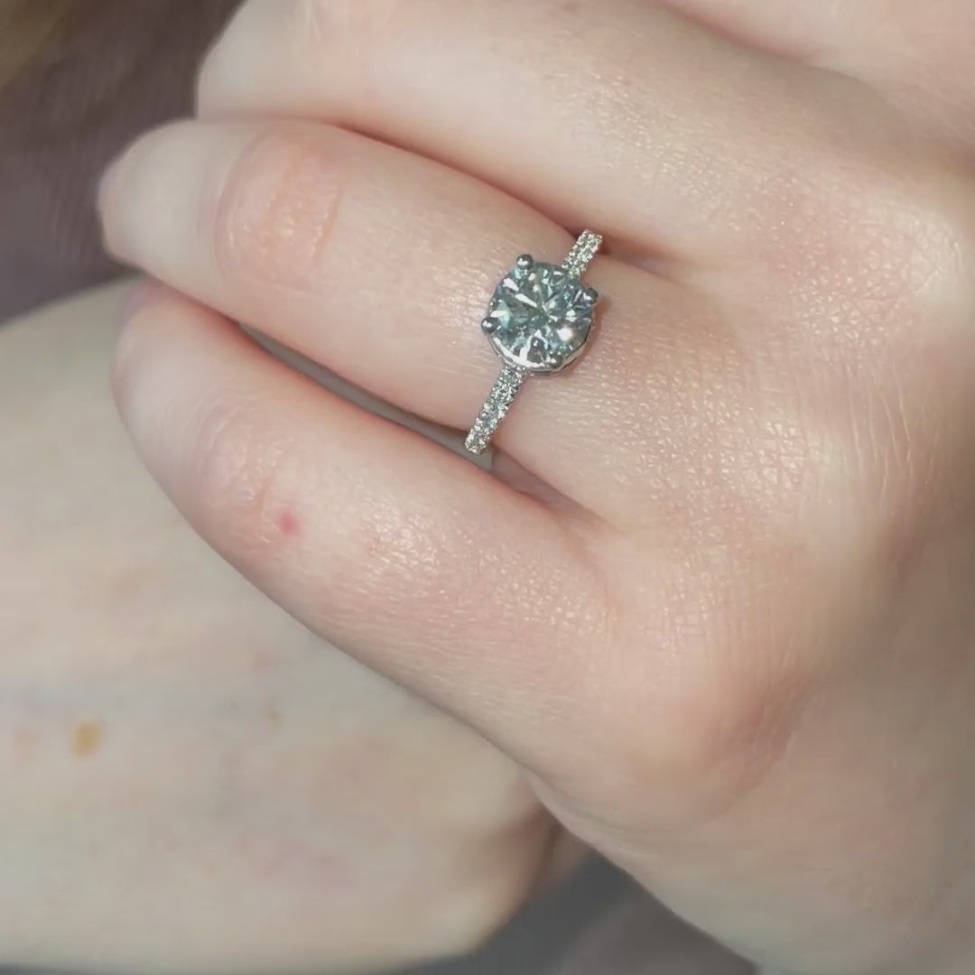 video of model wearing 1.5ct solitaire in platinum and shoulder set band