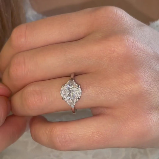 Close up video of The Mille Ring, by Ethica Diamonds, lab grown diamonds, oval centre stone with half moon side stones.