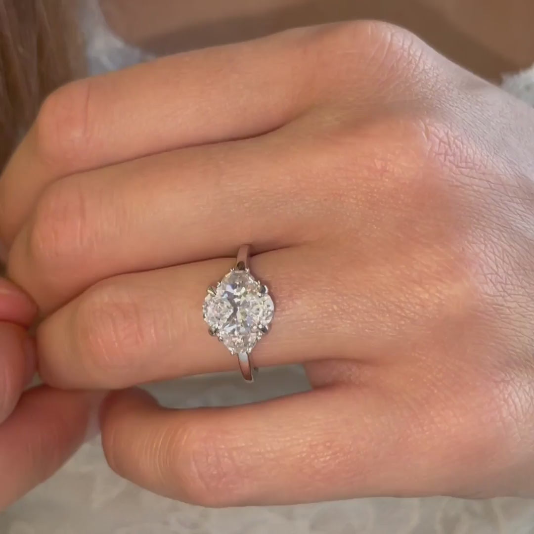Close up video of The Mille Ring, by Ethica Diamonds, lab grown diamonds, oval centre stone with half moon side stones.