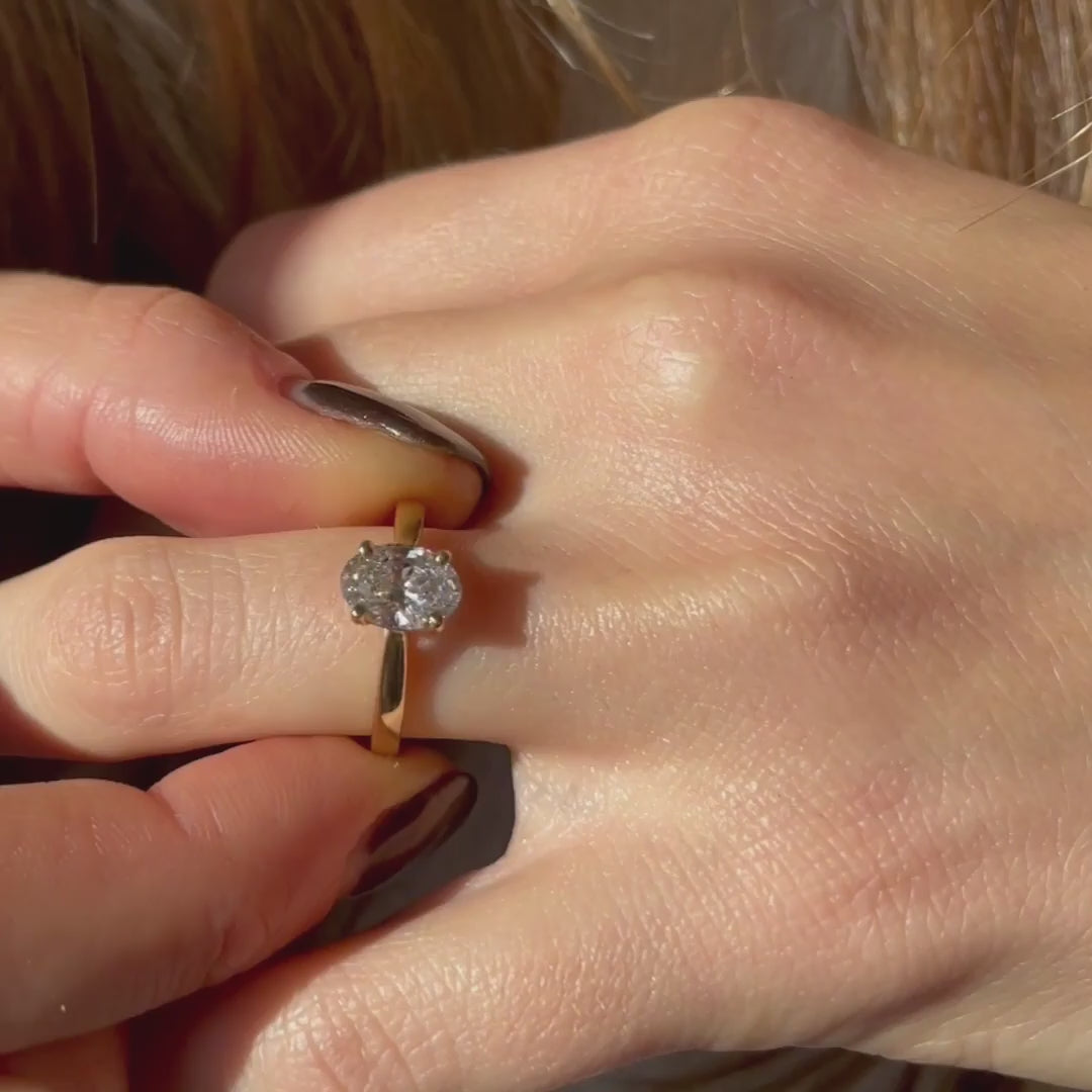 Video of model showing the classic oval shaped Poppy Solitaire ring