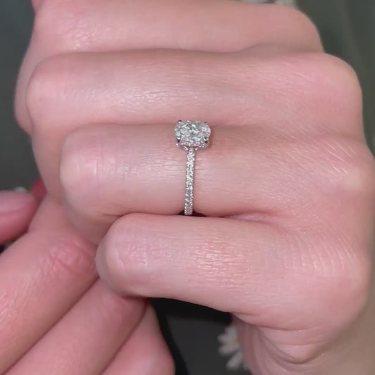 Model wearing dainty 1 carat diamond ring by ethica diamonds with whisper thin band and hidden halo and shoulder set diamonds