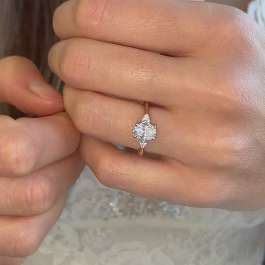 video of Marina Ring with subtle hidden halo, slim modern band, and oval and pear diamonds