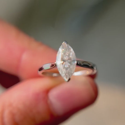 Model holding a classic style Rosemont Ring with a striking marquise cut centre gem