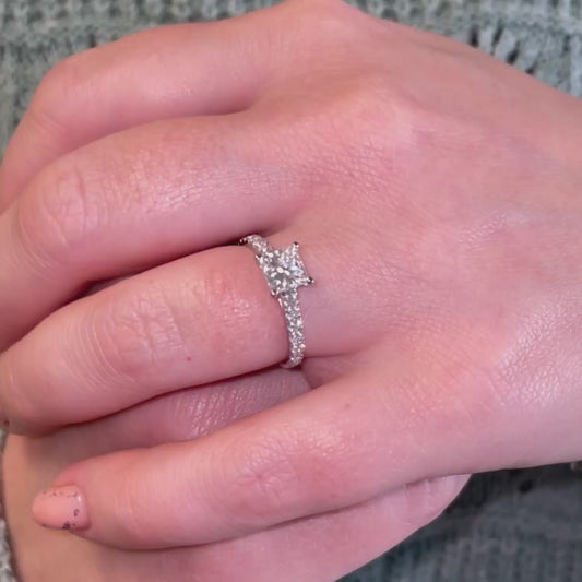 Model showcasing 1 carat princess cut lab created diamond with small diamonds set into band