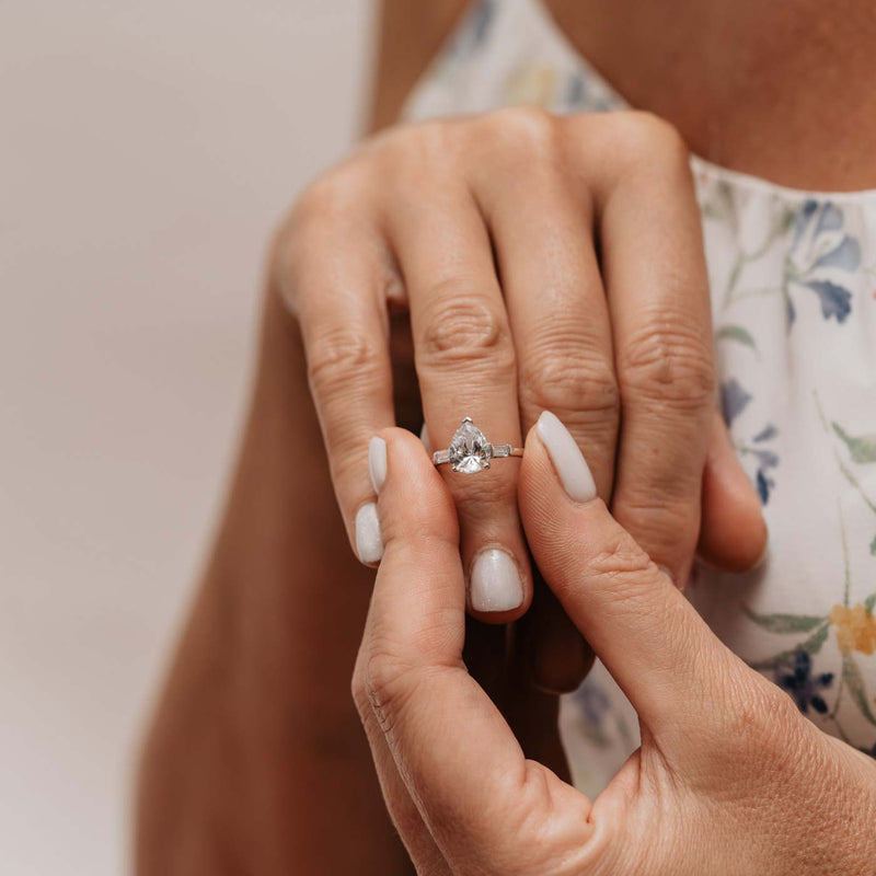 Cami Trilogy Ring by Ethica Diamonds, pear cut center with tapered baguette side diamonds